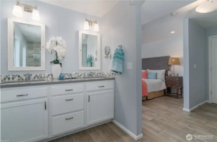 Downstairs bathroom featuring double sinks and vanity.
