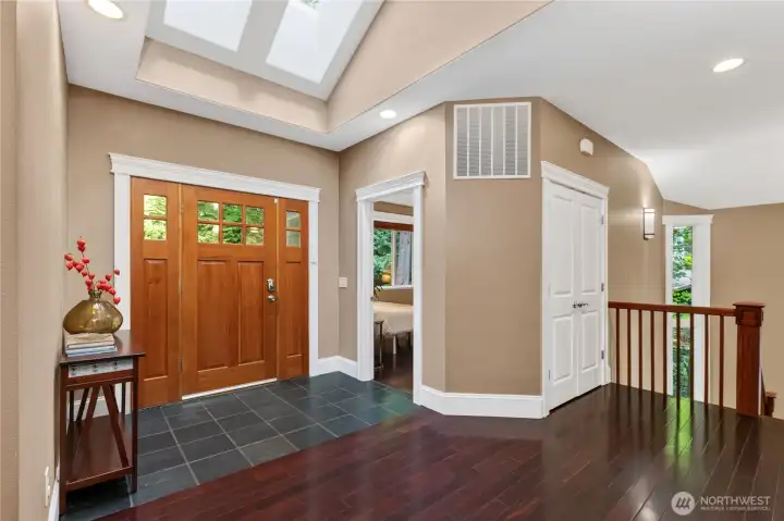 Walk into the bright foyer with vaulted ceilings and skylights.