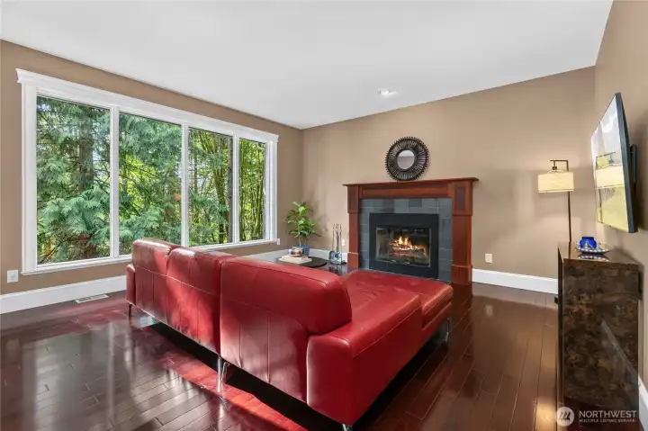 Enjoy a cozy wood burning fireplace and views of the forest.