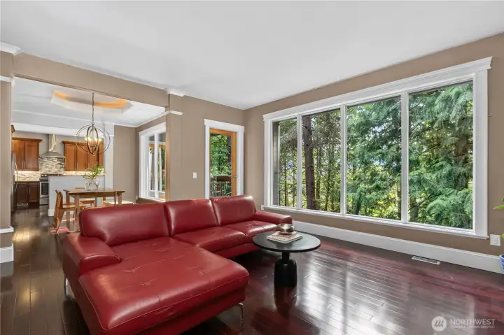 Large picture windows, covered patio access and a seemless flow into the dining area, are highlights of this living room.