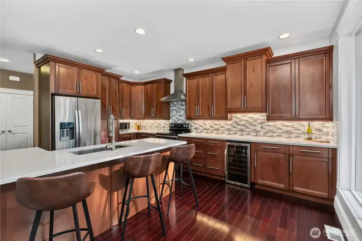 Upgraded counters, backsplash and wine fridge.