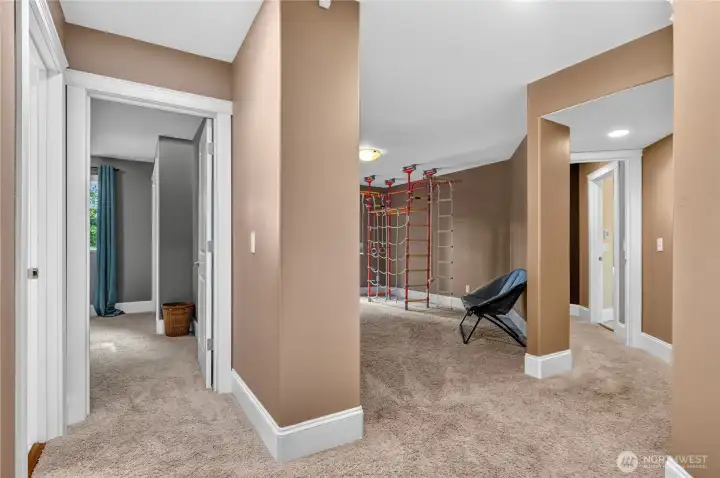 The daylight basement featuring the primary BR, two additional bedrooms, laundry room, family room and two updated bathrooms.