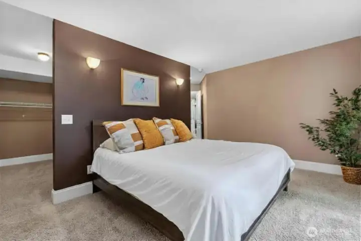 Primary bedroom with luxury en suite bathroom and walk-in closet.