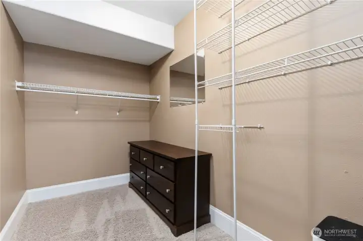 Walk-in closet in the primary bedroom.