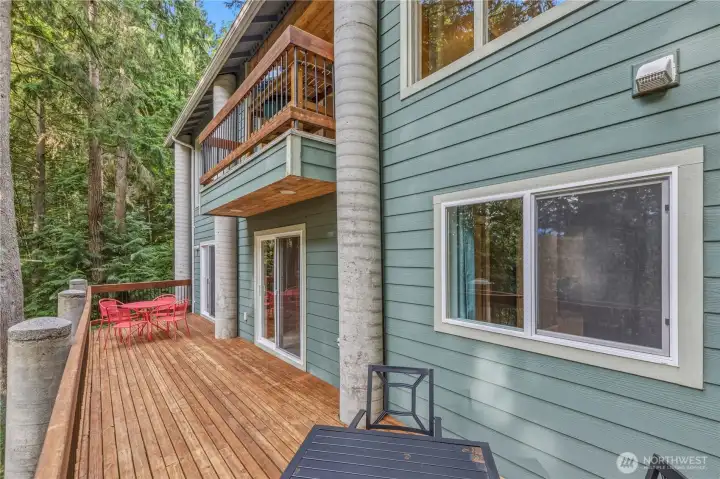 Soak in the views and enjoy the large deck that spans the entire length of the home with access from the primary bedroom and family room.