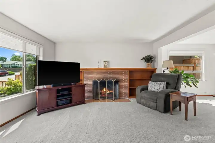 This inviting living room centers around a classic fireplace, creating a warm and comforting focal point for the entire space. This inviting living room centers around a classic fireplace, creating a warm and comforting focal point for the entire space.