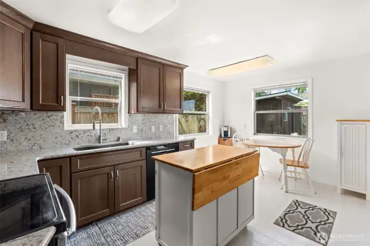 This bright and beautifully structured kitchen pairs incredible functionality with enduring style. Featuring a smart layout, excellent prep space, and classic charm, it is perfectly designed for effortless meal prep and daily gathering alike. This bright and beautifully structured kitchen pairs incredible functionality with enduring style. Featuring a smart layout, excellent prep space, and classic charm, it is perfectly designed for effortless meal prep and daily gathering alike.