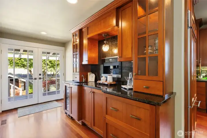 Lighted wet bar with built-in Miele coffee/espresso maker and wine refrigerator. Lighted wet bar with built-in Miele coffee/espresso maker and wine refrigerator.