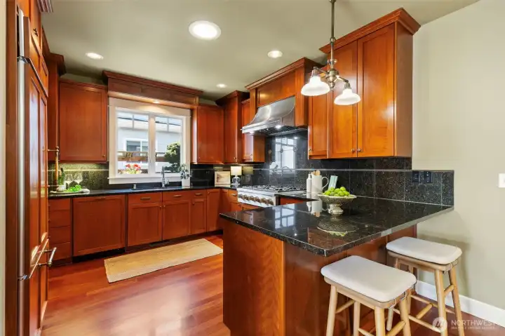 Custom Cherry cabinets and granite countertops and back splash. Custom Cherry cabinets and granite countertops and back splash.