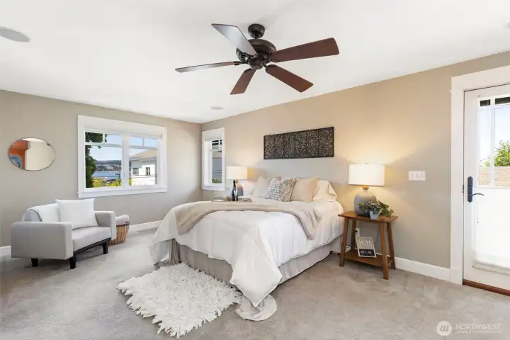 Primary Bedroom with access to back deck. Primary Bedroom with access to back deck.