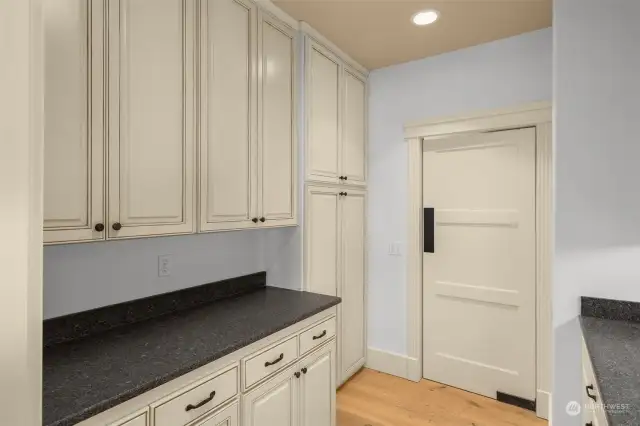 Butler's pantry off kitchen leads to dining room