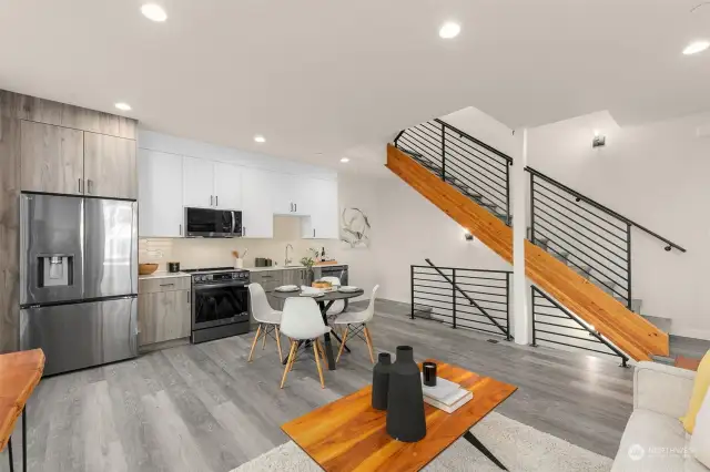 The open staircase & wood accents create a clean, industrial aesthetic.