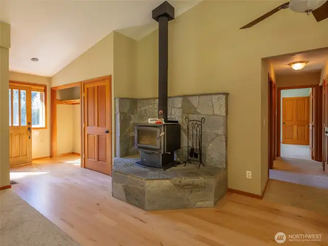 The custom fireplace with built in bench. German Birch hardwood floor have been recently refinished. office space and g=bedrooms down the hall.