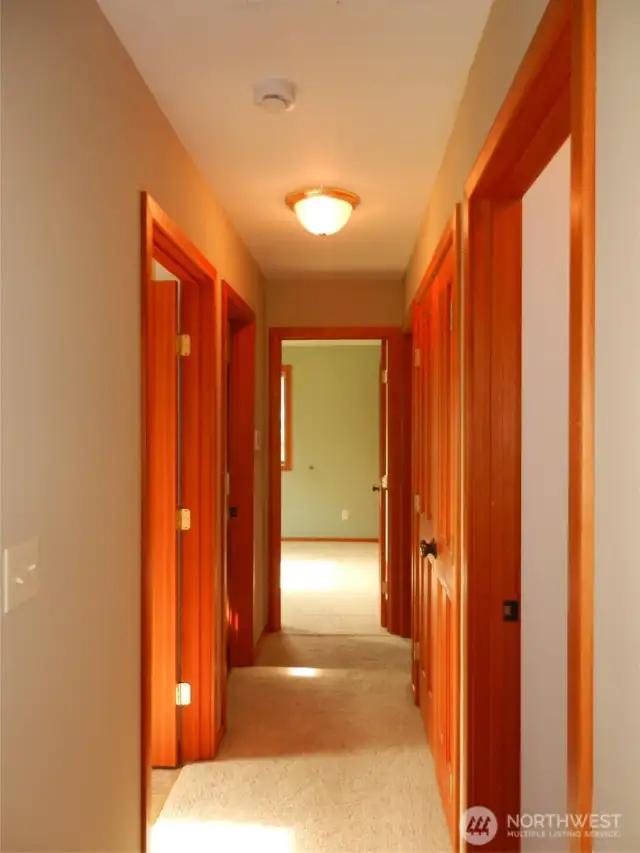 Hallway with office, full bath on left. Bedroom at end of hallway with master bedroom end of hallway to right.