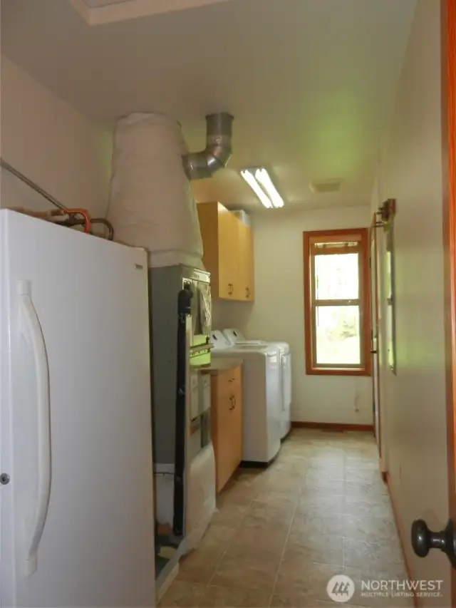 Laundry room/mudroom. Brand new washer and dryer included.