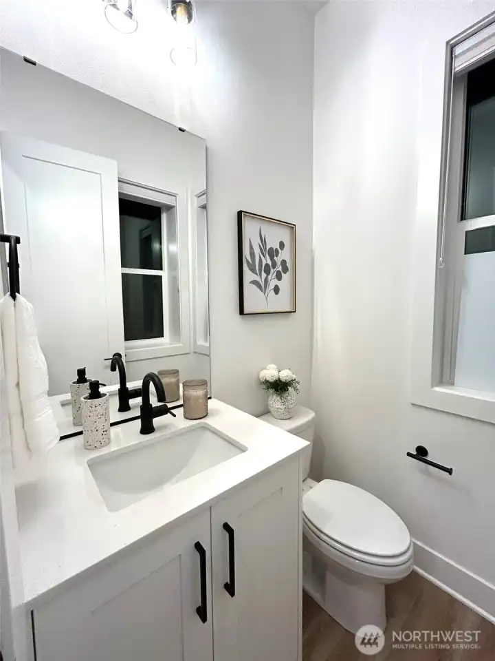 Main floor powder (staging and furniture are for decoration and not included in the sale of this home)