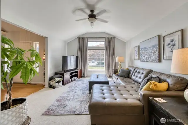 The formal living room with the spacious foyer on the left. The vaulted ceilings add a nice sense of space and dimension.