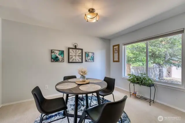 The formal dining room looks out to the private back yard.