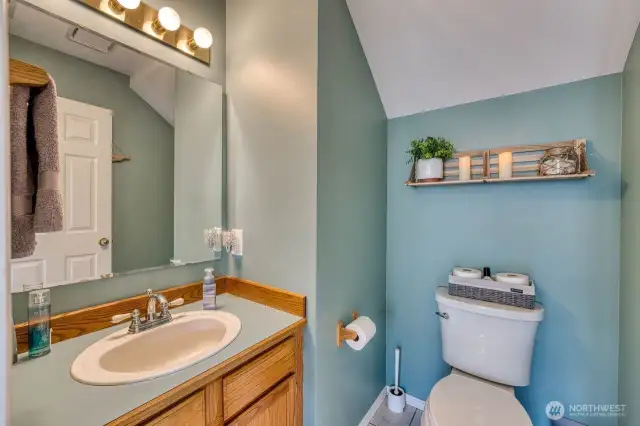 The main floor half bath located off the spacious family room.