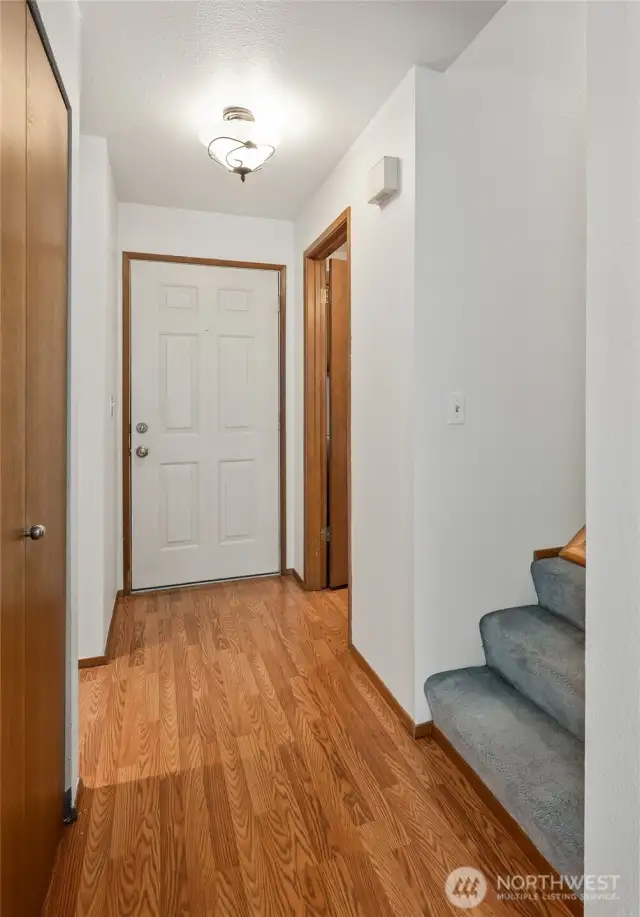 Here is the Front door, half bath, pantry closet and stairway.