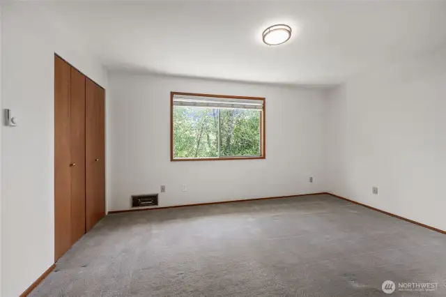 Master bedroom has a beautiful private view of the trees.