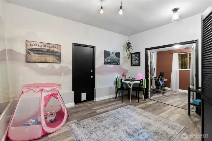 Family room off kitchen leads to office (3rd bedroom) and shop.