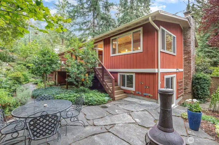 Patio in lovely & private landscaped backyard.