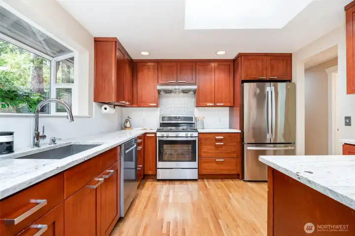 Timeless cabinetry, stainless appliances and ample counter space is a delight for any chef.