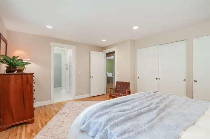 Primary suite facing the bathroom and door to hallway