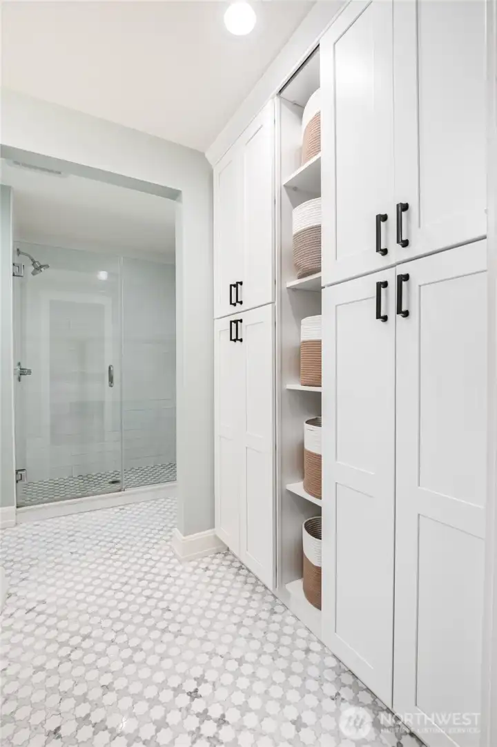 Additional storage abounds in the primary bath