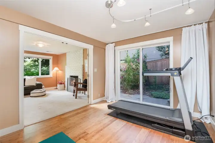 Lower level bedroom, currently used as exercise and craft room has slider leading to back patio.