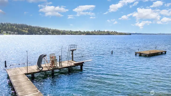 Dock with slide and diving board as part of your deeded co-ownership of Beaux Arts community waterfront.