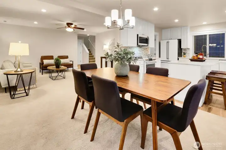 Ideal open concept living with thoughtful updates, like ceiling fans, lighting on dimmer switches throughout the home and more.