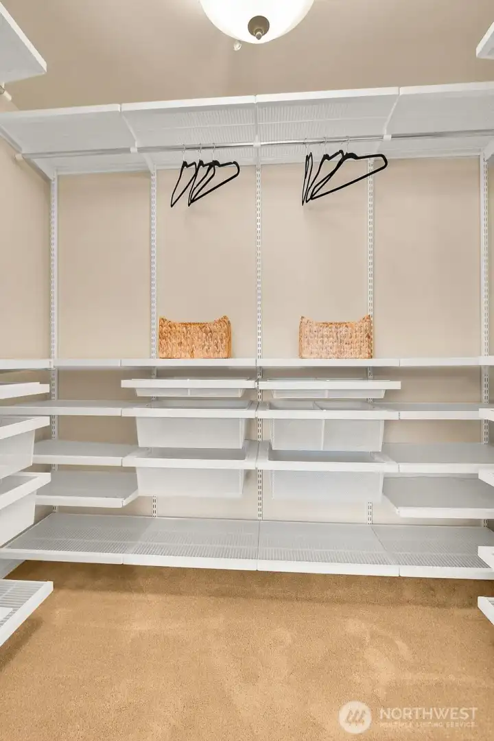 Primary walk-in closet with amazing storage and room for it all!!