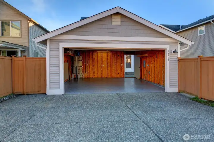 Pull into the detached garage and it is just a few steps to the kitchen door. Notice the brand new epoxy garage floor!