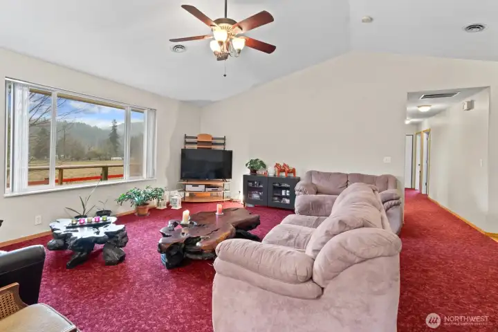 Living Room Area looking out to Deck and Back of Property