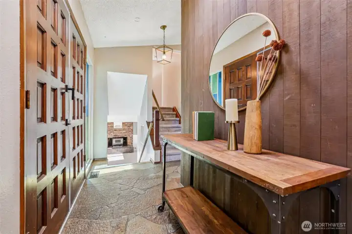 Wood clad entryway relays this homes' MCM vibes.