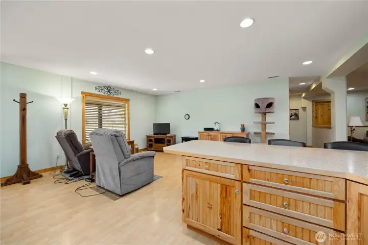 Set up for small gatherings, this common area is designated dining room.  View from the kitchen.