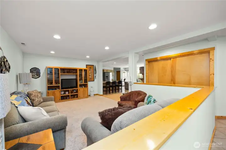 Looking from the hallway through the living room.  Pantry/double closet in hallway provides ample space for many supplies.