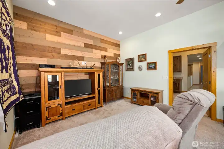 Currently used for watching sports and relaxing on one end, while the other end is set up for an office.