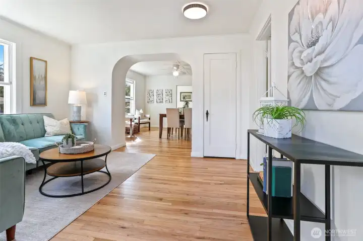 Living room with refreshed oak hardwoods.