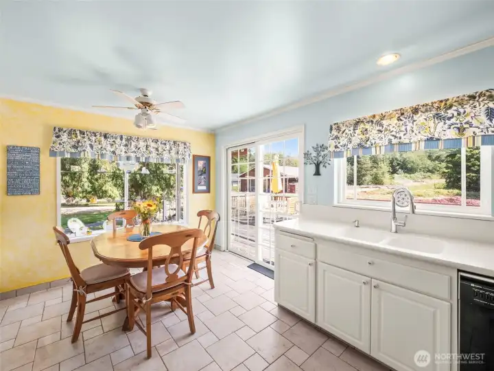 Kitchen eating soace and to the back deck looking over to the barn