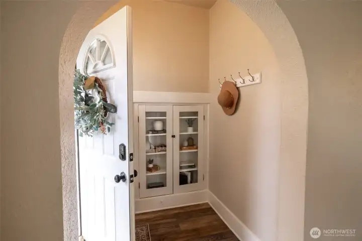 A welcoming entry way with beautiful arches, original built-ins and plenty of charm welcomes you into this classic Tacoma craftsman.