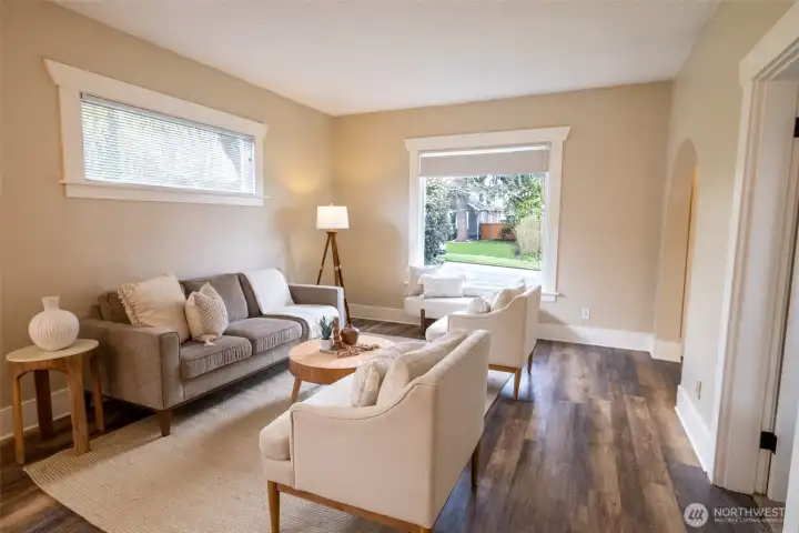 The large bay window in the front of the home beautifully frames the cherry blossoms, currently in bloom.