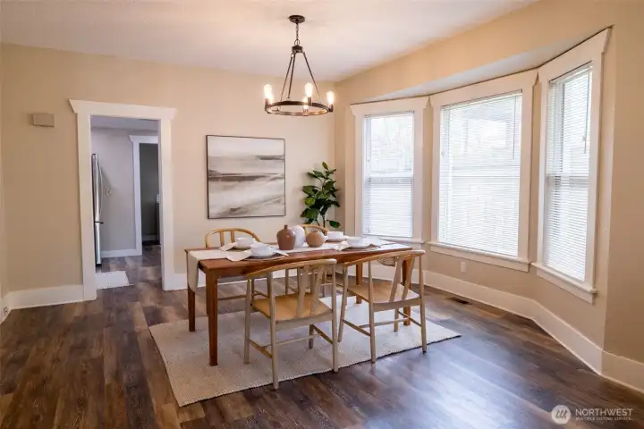 The large dining space, right off the kitchen, has room for family, friends, or even working from home.