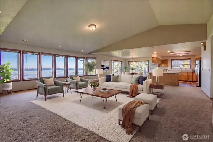 Great room with sweeping views of the bay, virtually staged