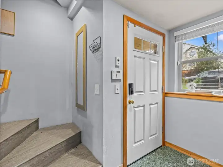 Front entryway leads to lower bedroom, lower bathroom, and back deck. Laundry on this floor as well.