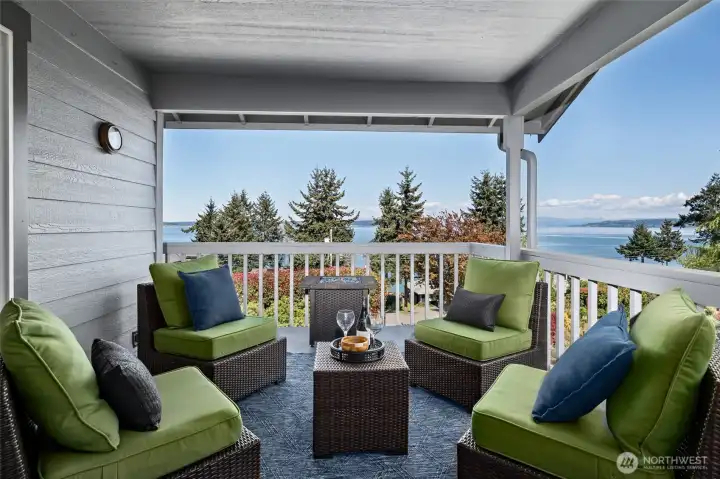 Covered deck with space for oversized out door furniture and beautiful water views