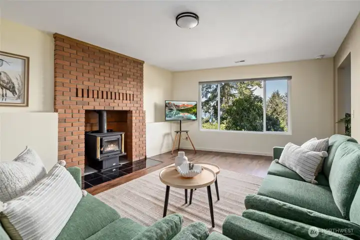 Family room with freestanding wood stove and beautiful brick fireplace surround