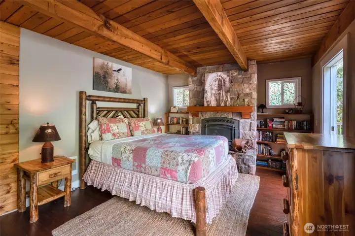 Primary suite boasts lovely river views, new gas fireplace and stone surround.
